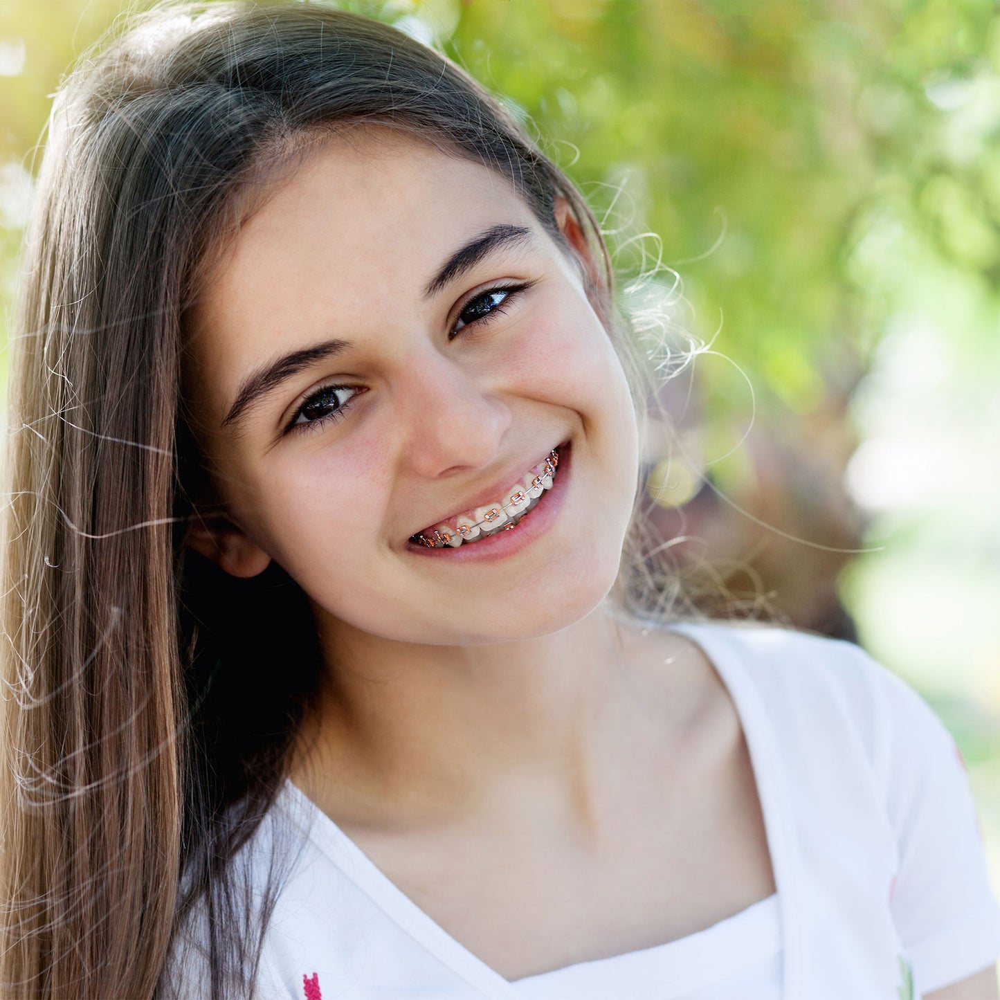 Teen Girl Smiling with Mini Twin Brackets