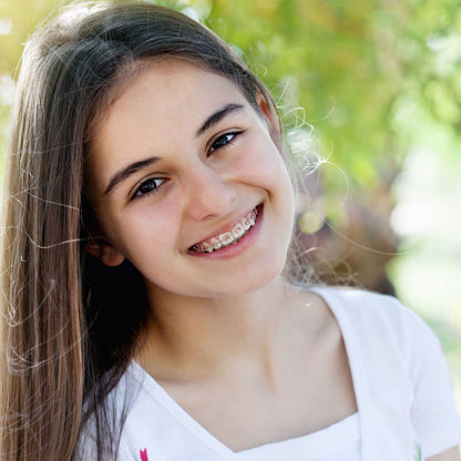 Teen Girl Smiling with Mini Twin Brackets